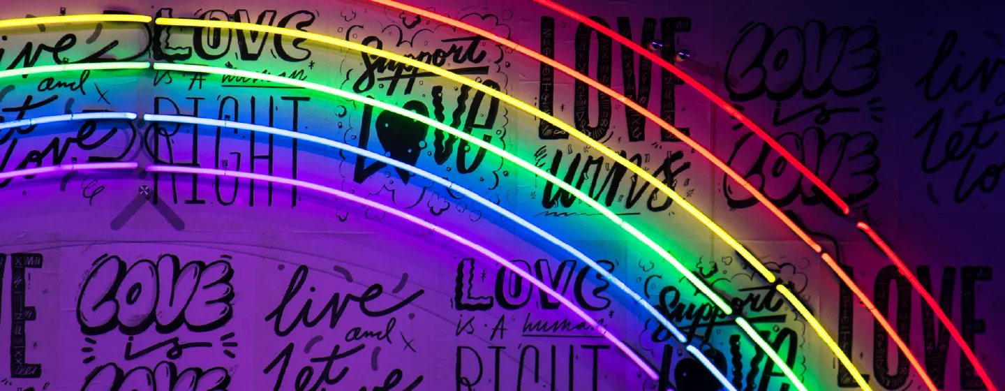 neon rainbow representing our inclusive and caring company values