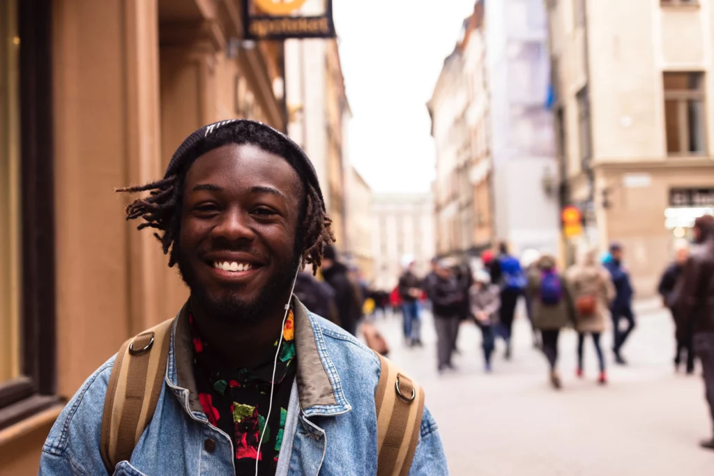 person smiling walking down the street